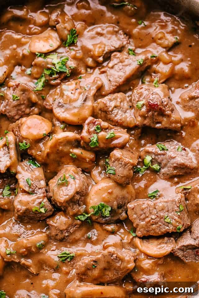 Serving beef tips in mushroom gravy with a side of green beans.