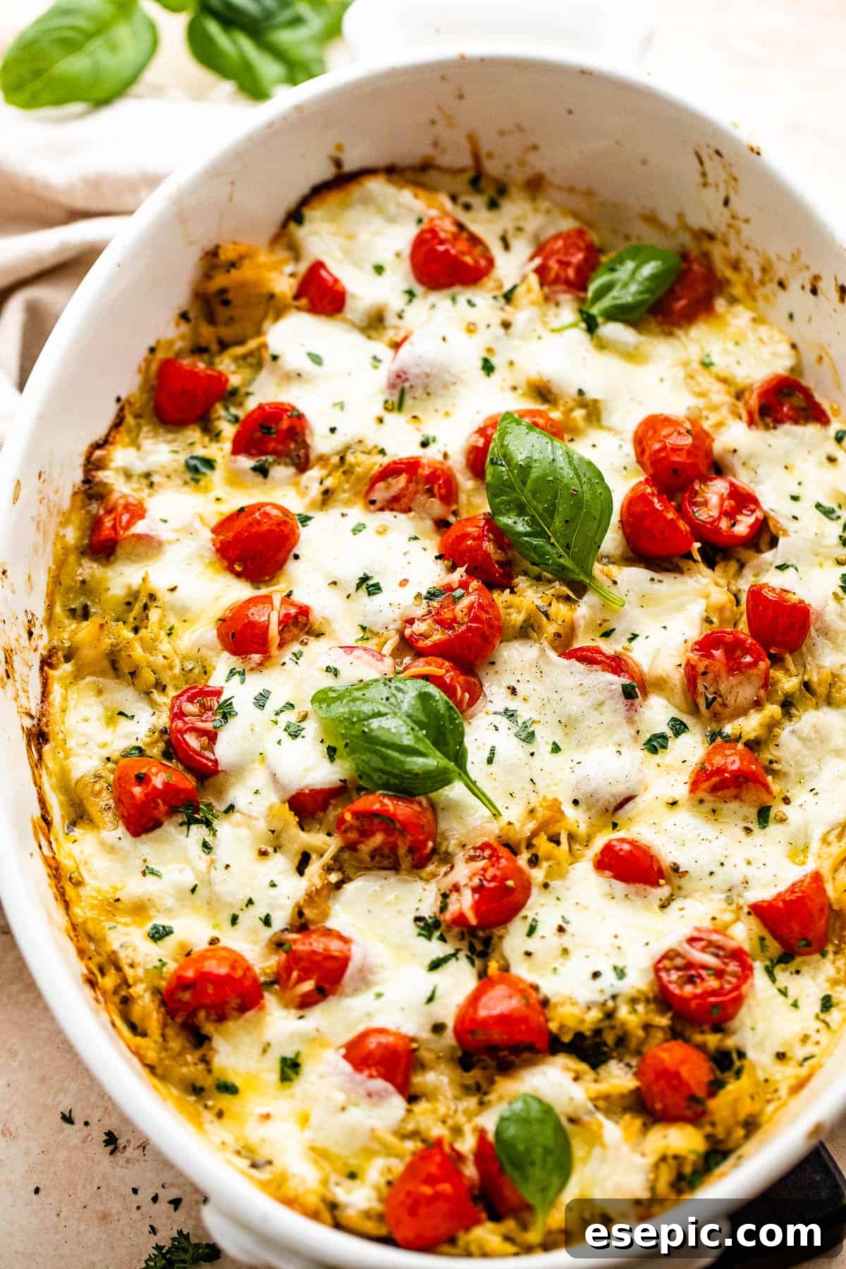 Flavorful Caprese Chicken Bake 3 Close-up of Caprese Chicken Casserole in a baking dish