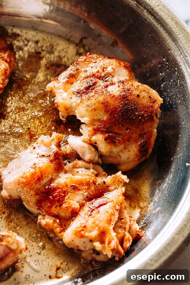 Juicy, tender, and flavorful, these pineapple barbecue chicken thighs are one of my favorite easy weeknight dinner ideas! Done in 20 minutes! Browning boneless skinless chicken thighs in a skillet to achieve a golden crust.