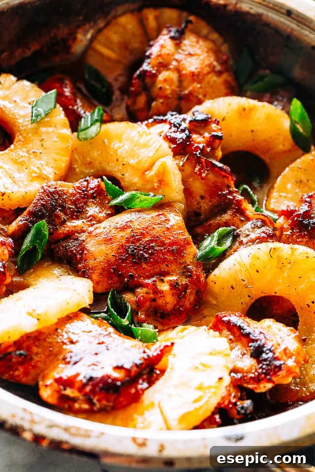 Juicy, tender, and flavorful, these pineapple barbecue chicken thighs are one of my favorite easy weeknight dinner ideas! Done in 20 minutes! Finished Pineapple Barbecue Chicken Thighs in a skillet, garnished with green onions and ready to eat.