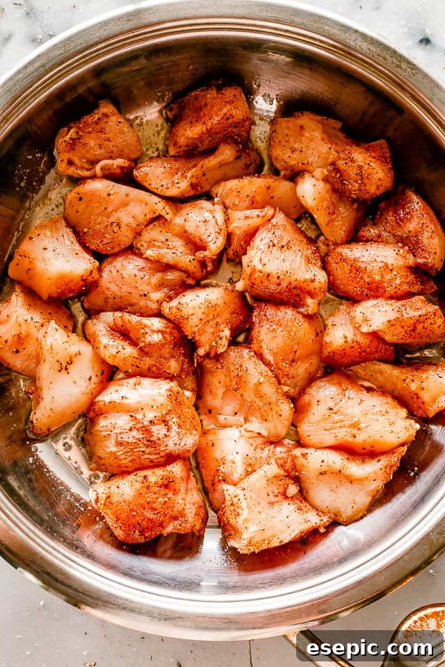 The absolute easiest chicken recipe you will ever see. Taco chicken bites are simple, fun, and full of flavor. Perfect for busy weeknights! Cooking chicken bites in a skillet.