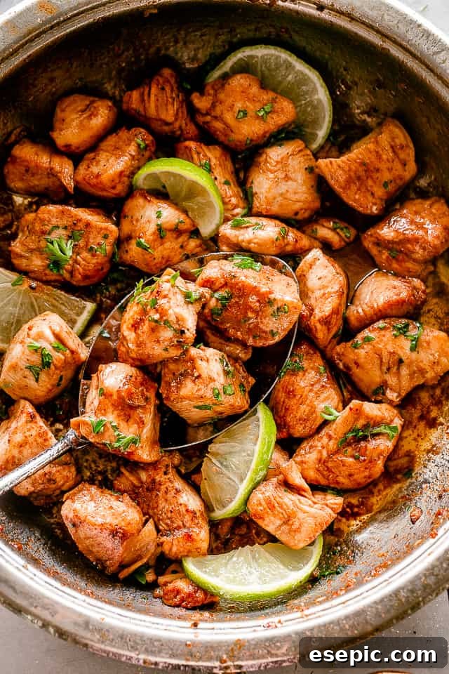 The absolute easiest chicken recipe you will ever see. Taco chicken bites are simple, fun, and full of flavor. Perfect for busy weeknights! Skillet filled with chicken bites