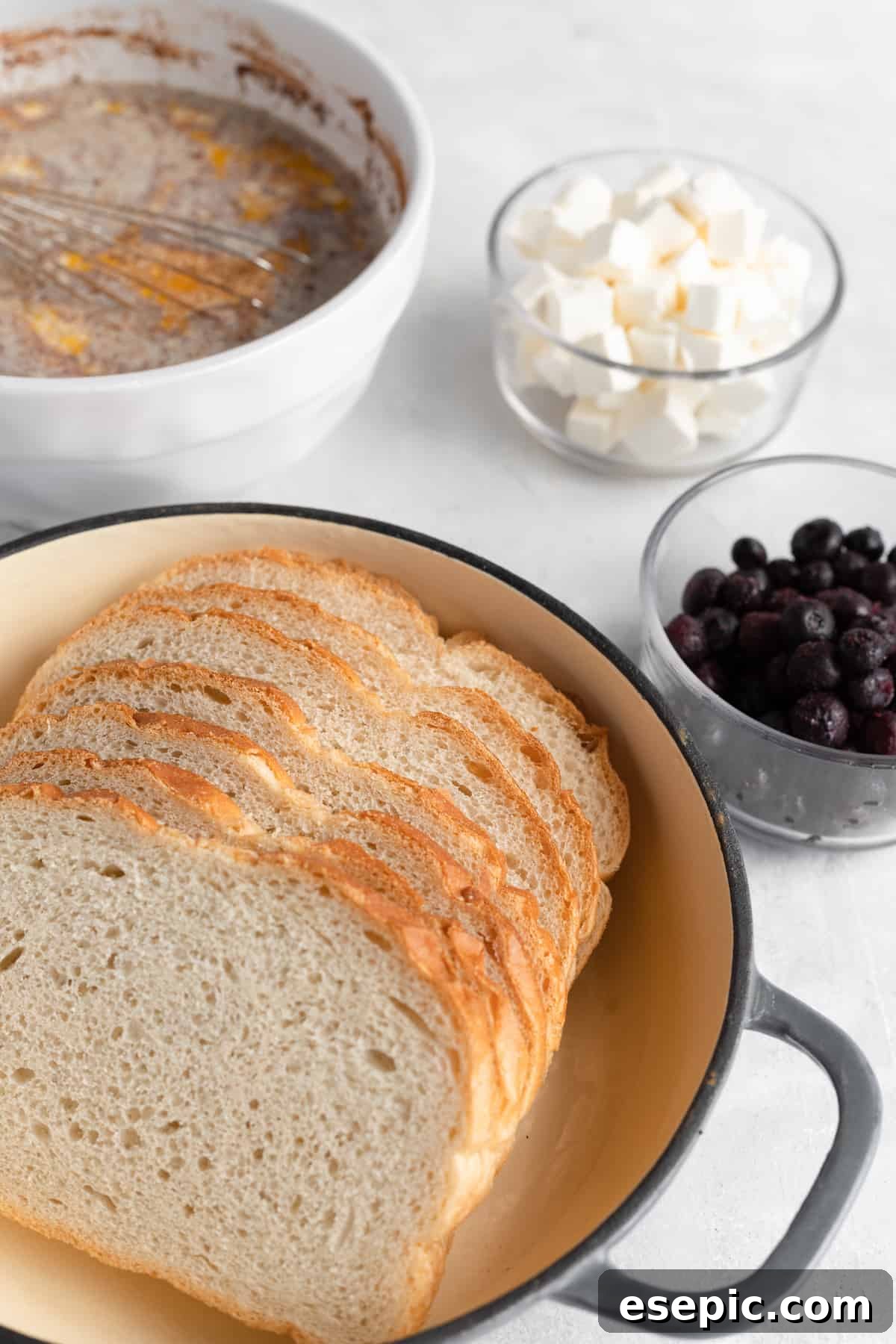 Sourdough Bread, Cream Cheese, Blueberries and the Rest of the Casserole Ingredients on a Countertop
