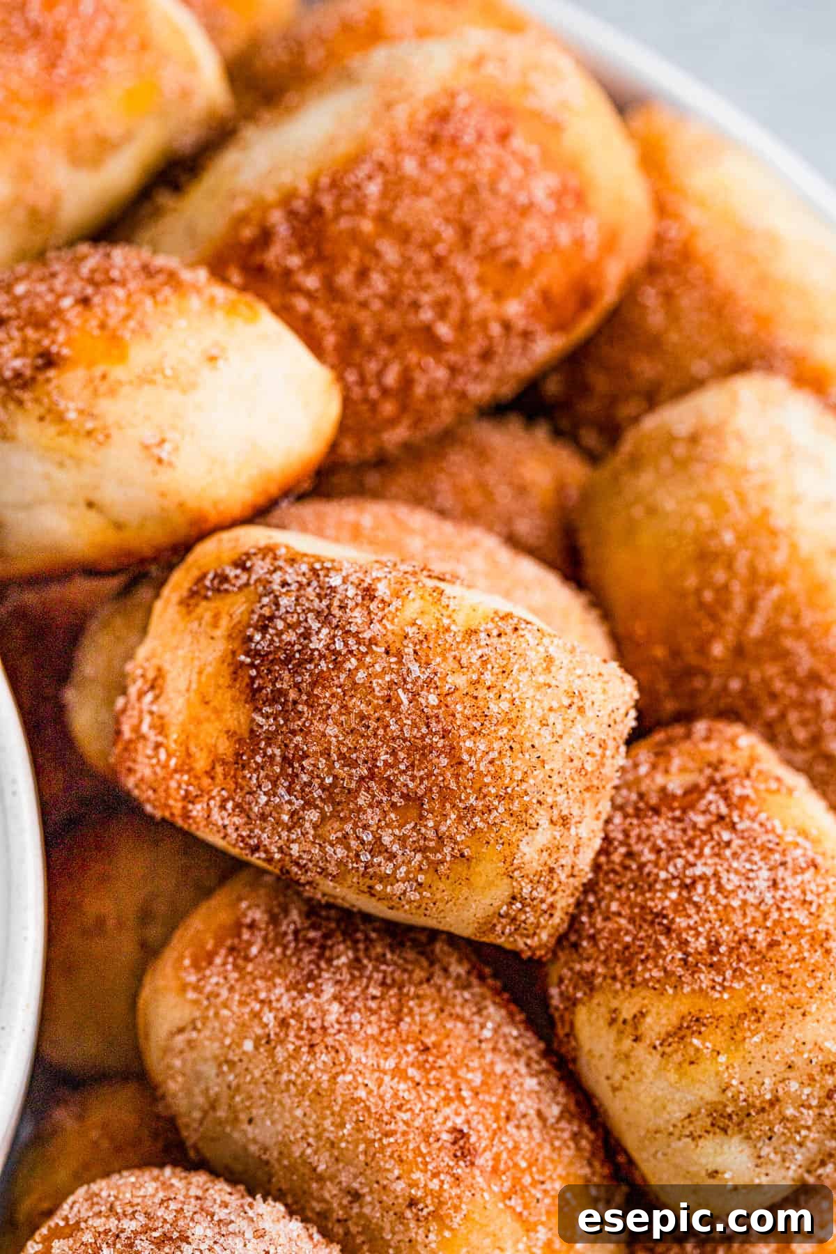 Cinnamon Sugar Pretzel Poppers 2 A stack of cinnamon sugar pretzel bites with a sprinkle of cinnamon sugar