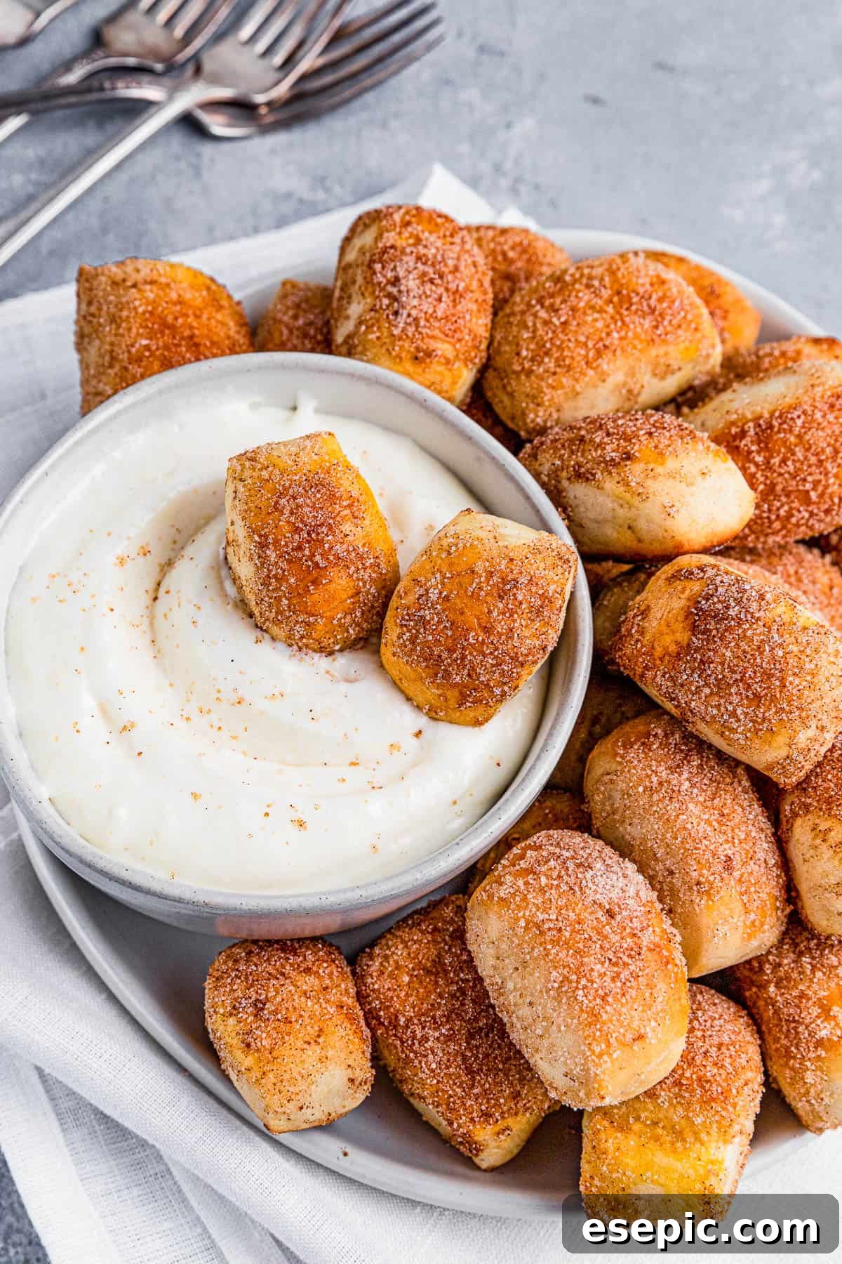 Cinnamon Sugar Pretzel Poppers 11 A cinnamon sugar pretzel bite dipped into creamy white dipping sauce