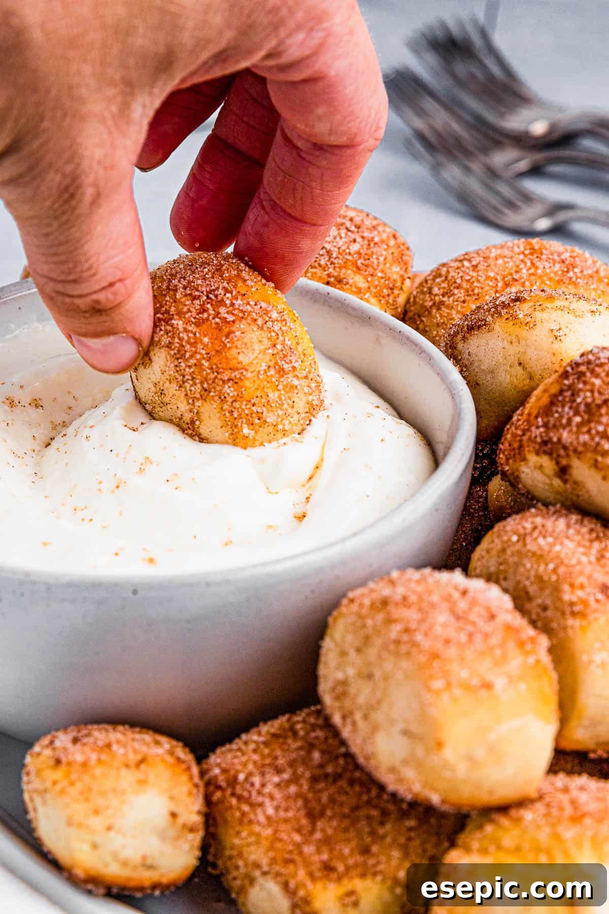 Cinnamon Sugar Pretzel Poppers 9 Cream cheese dip in a white bowl, ready for serving