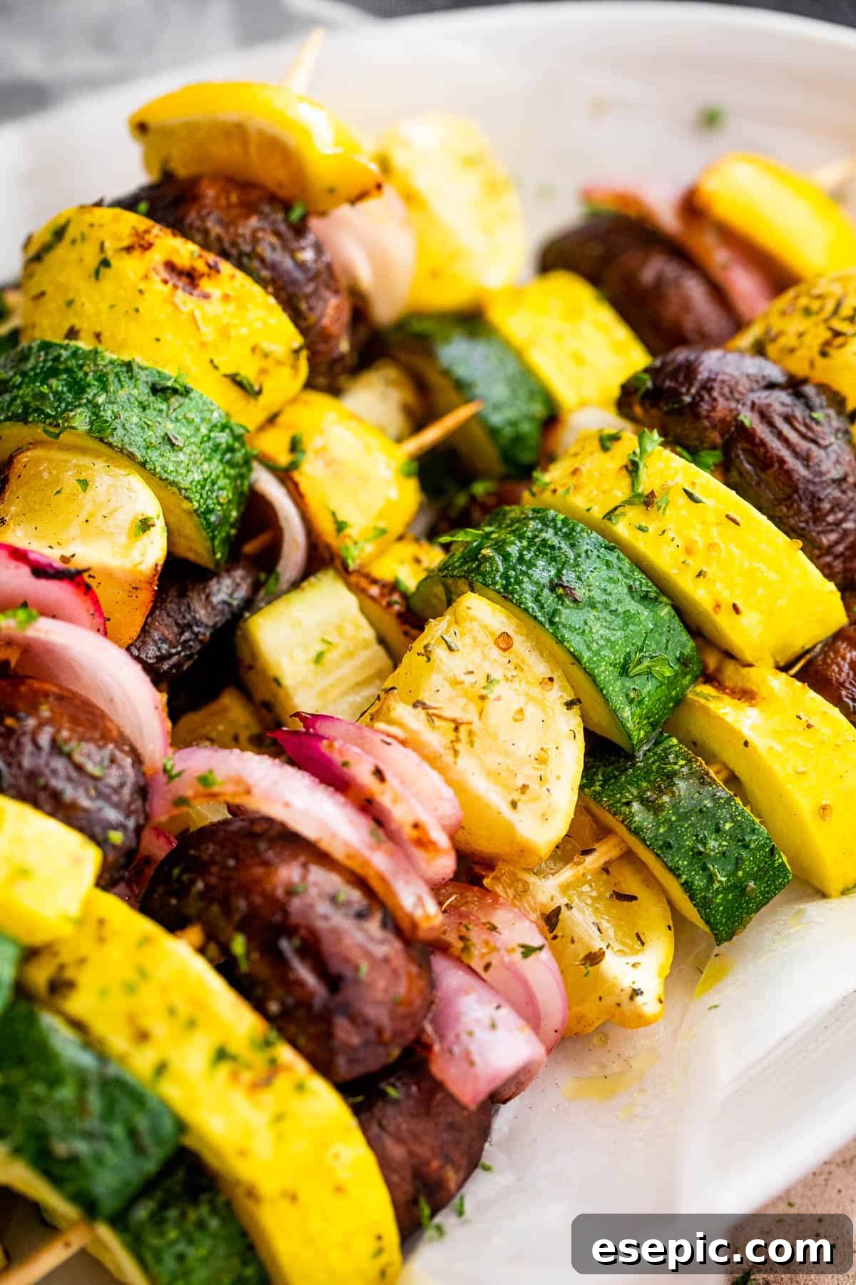 Side view of elegantly plated grilled summer squash skewers, ready to be served.