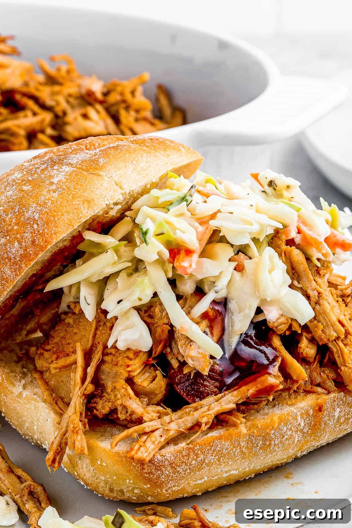 sandwich buns with pulled pork topped with coleslaw