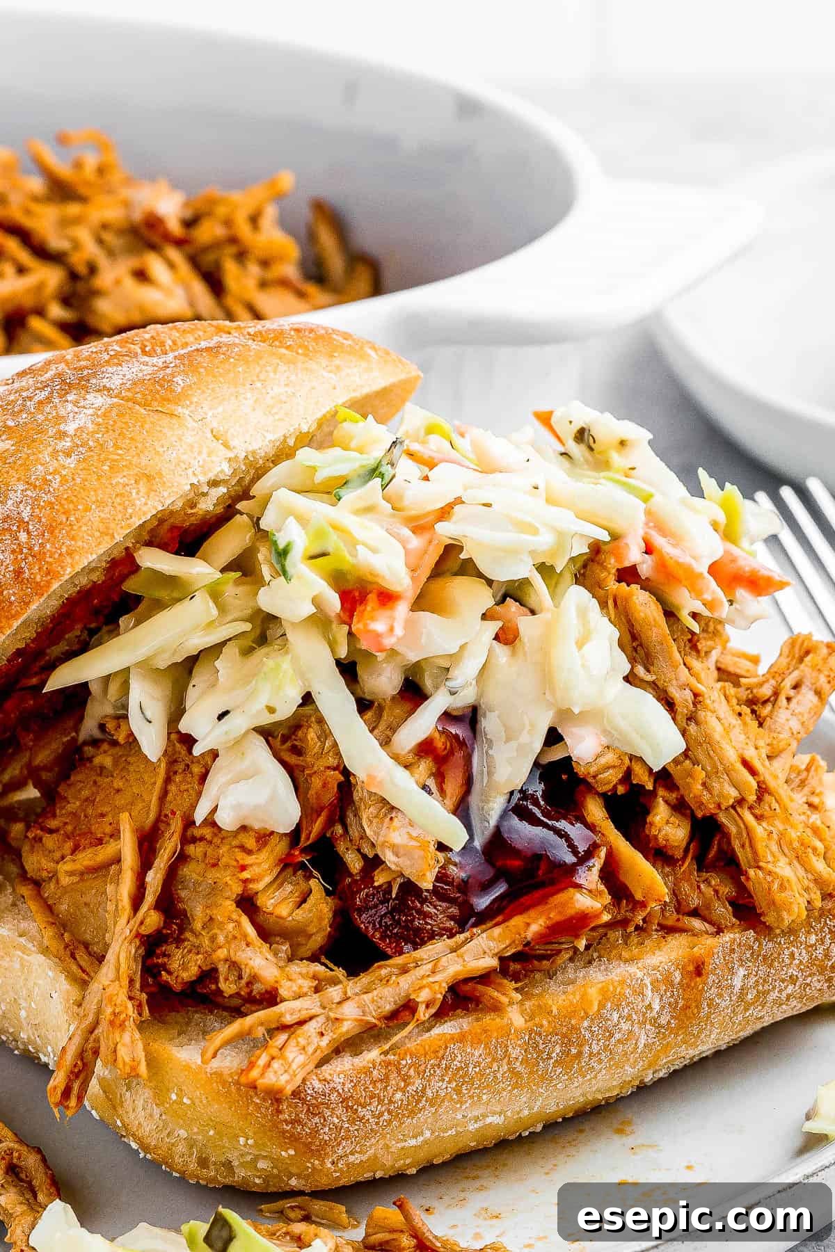 sandwich buns with pulled pork topped with coleslaw