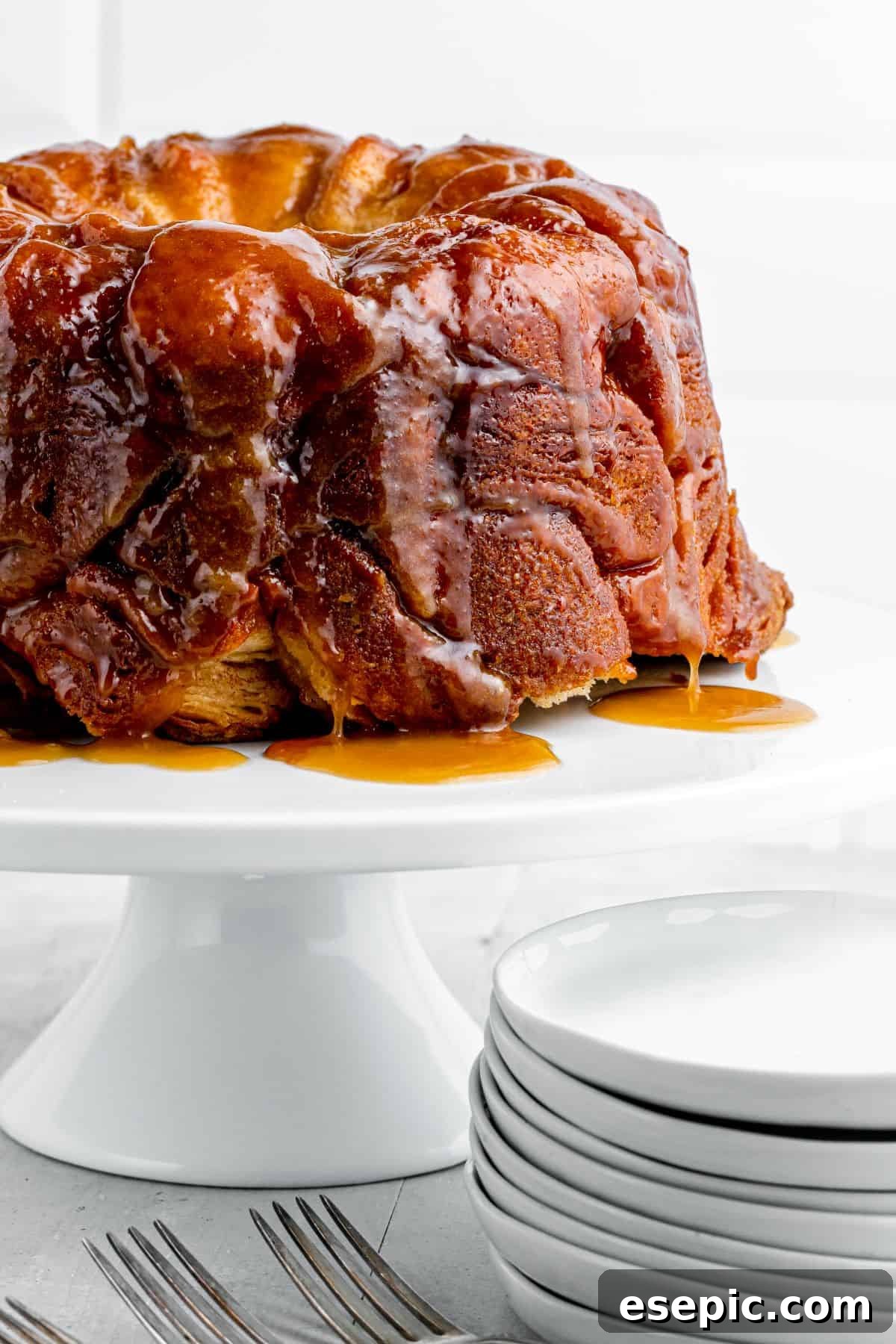 Deep golden-brown monkey bread with buttery glaze, fresh out of the oven.