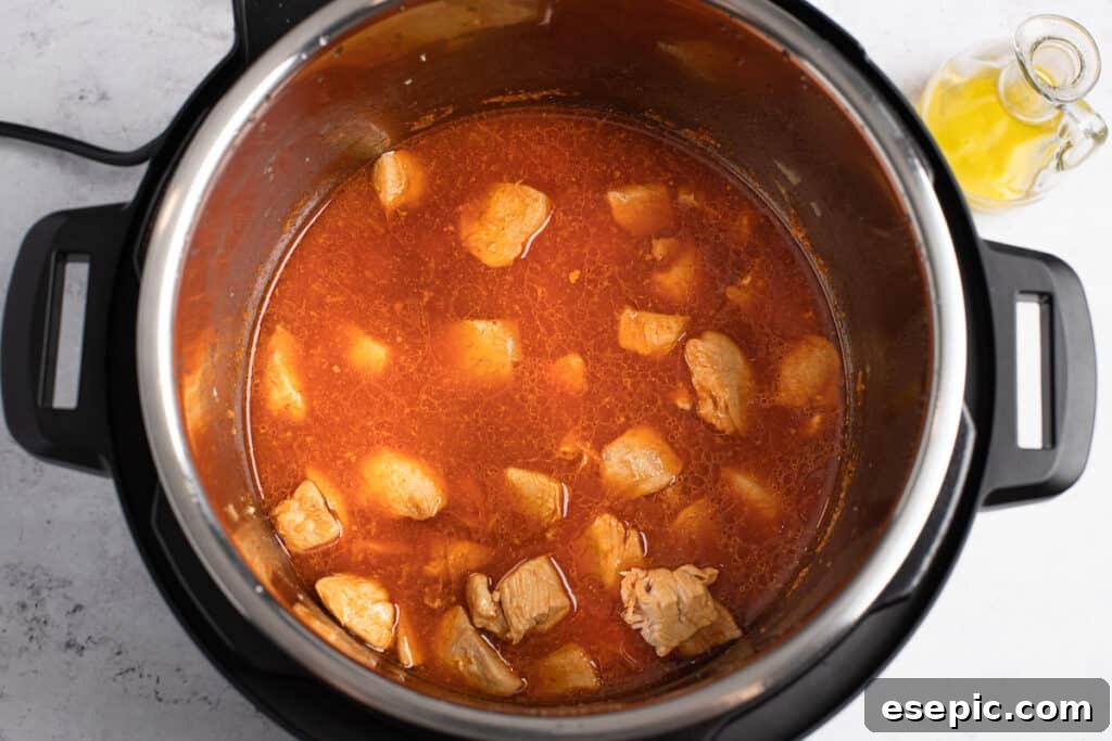 Effortless Instant Pot Orange Chicken 6 Cooked chicken and orange sauce