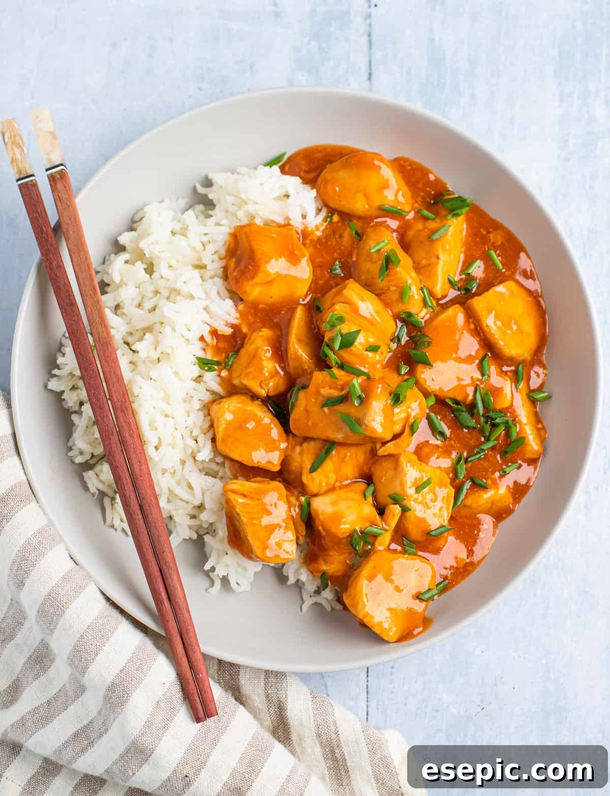 Effortless Instant Pot Orange Chicken 10 Centered overhead shot of orange chicken with rice.