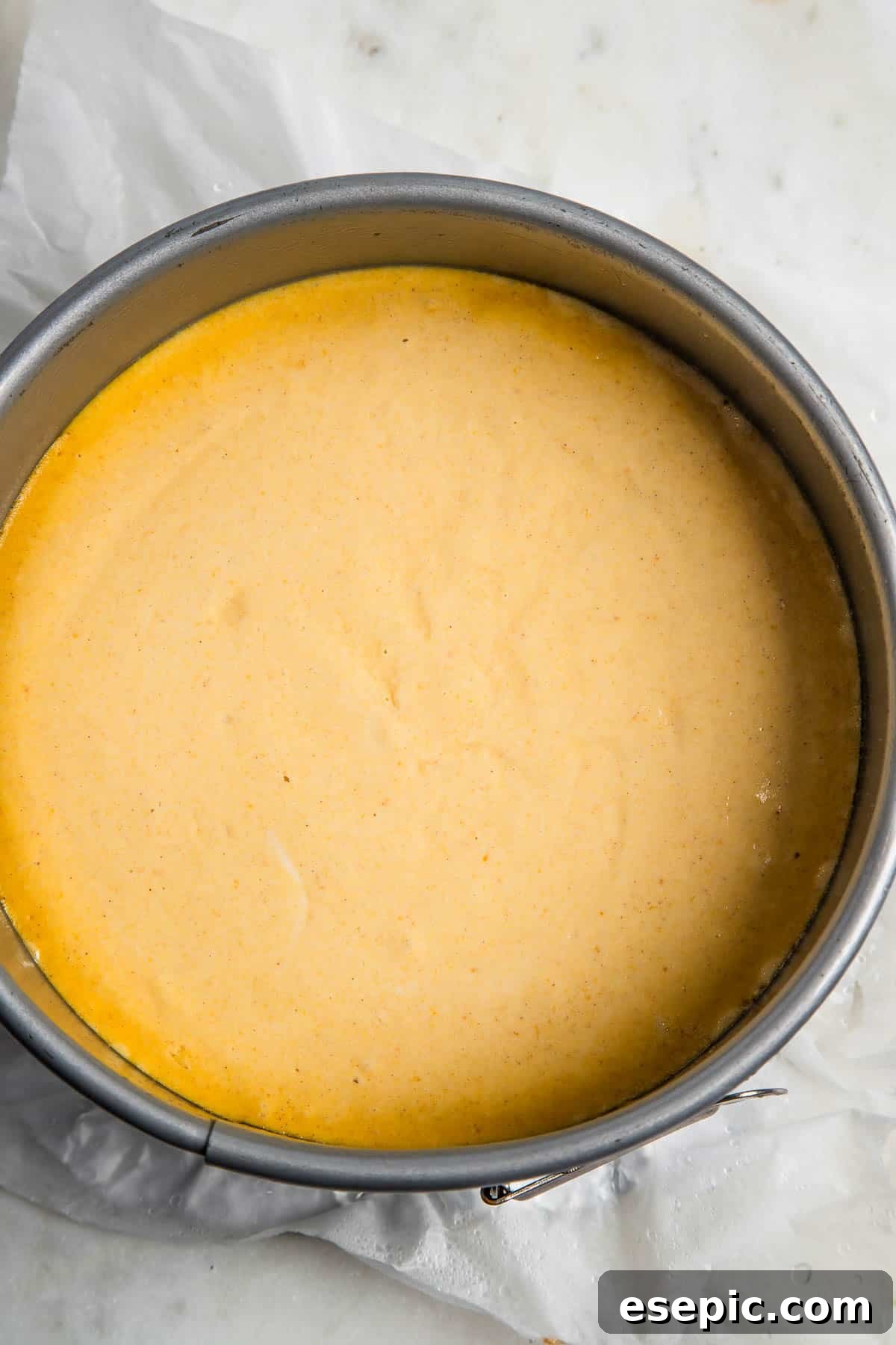 Spiced Instant Pot Pumpkin Cheesecake 5 A perfectly baked Instant Pot Pumpkin Cheesecake sitting inside the Instant Pot liner, showing a smooth, golden-brown top, ready to be cooled.