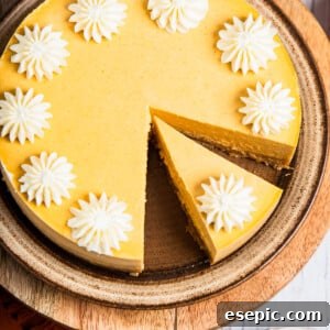 Irresistible Instant Pot Pumpkin Cheesecake 9 Pumpkin cheesecake decorated with whipped cream.