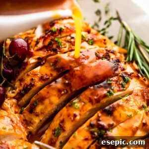 Roast a Perfect Turkey Breast Every Time 7 pouring gravy over sliced turkey breast