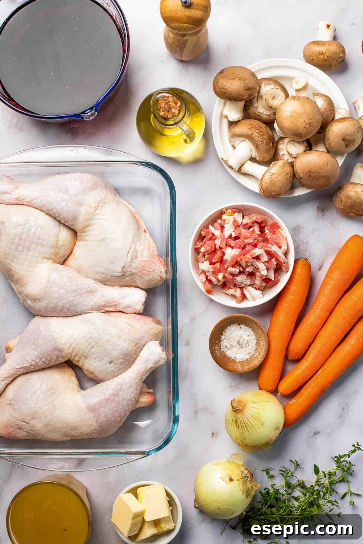 Quick and Classic Instant Pot Coq au Vin 3 Clockwise from top: Black pepper, mushrooms, carrots, bacon, salt, onions, fresh thyme, butter, chicken leg quarters, red wine.