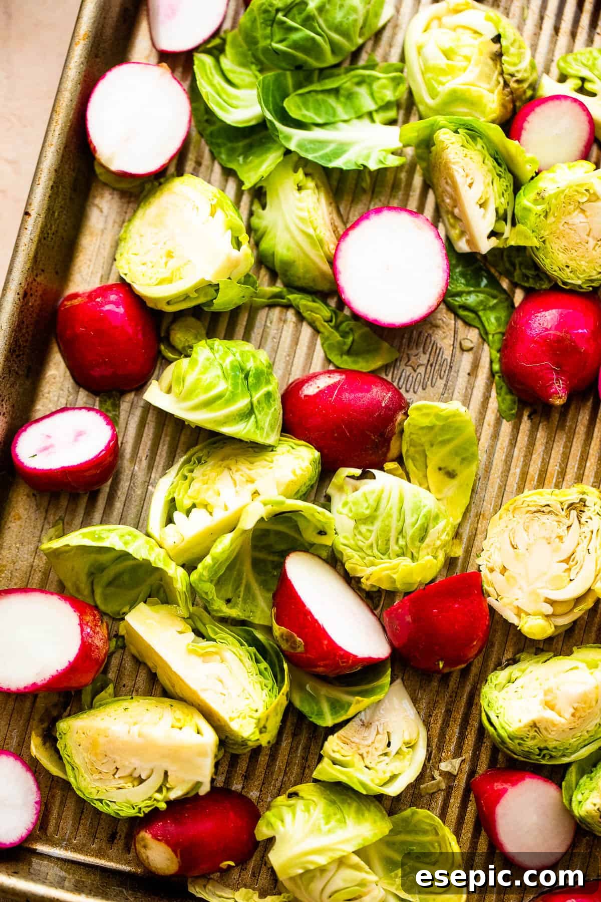 Crisp Roasted Brussels Sprouts and Radishes 4 A close-up view of fresh radishes and Brussels sprouts, perfectly trimmed and halved, ready for roasting.